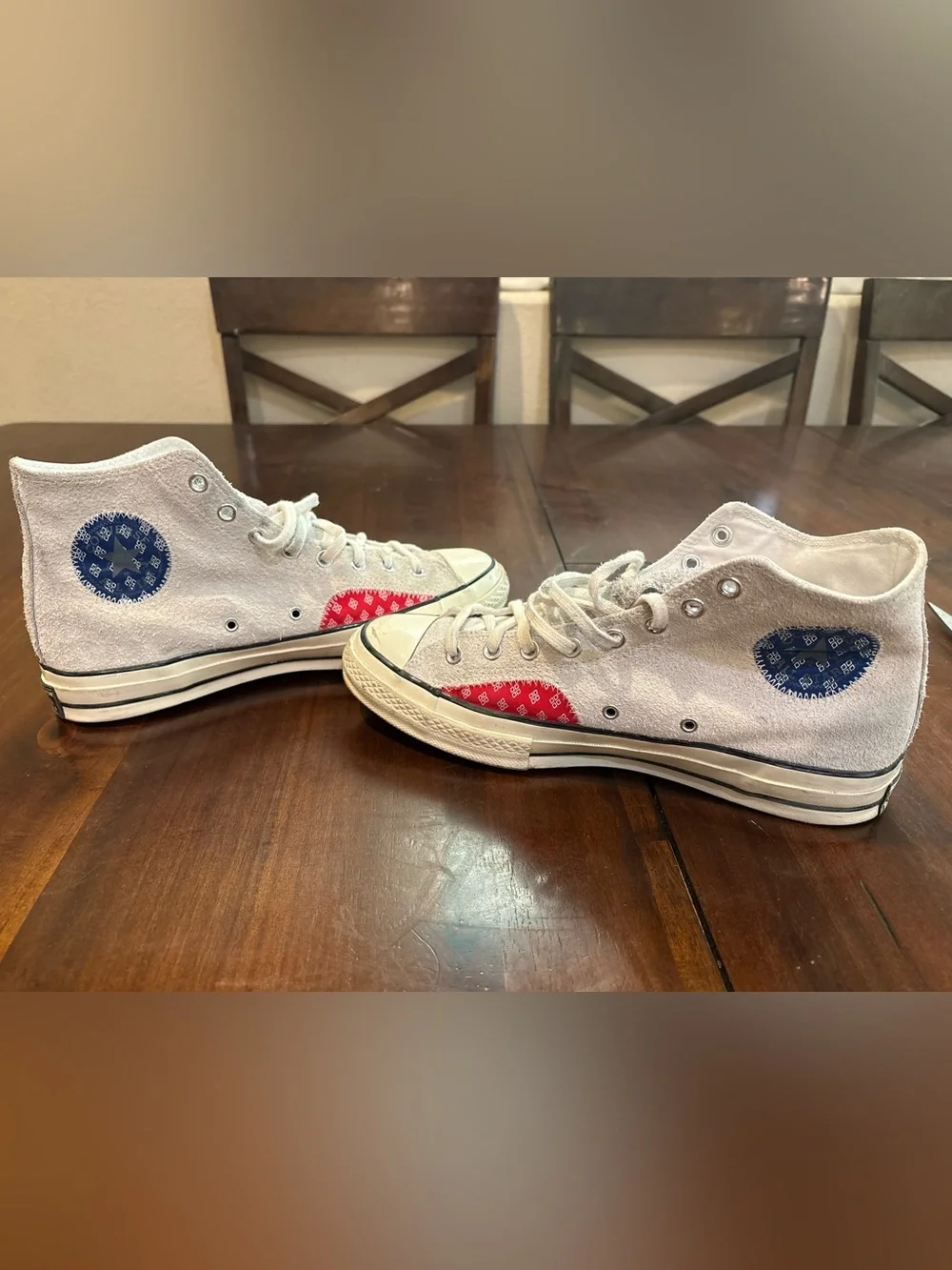 Converse Chuck Taylor’s White High Top Sneakers with Red and Blue Accents